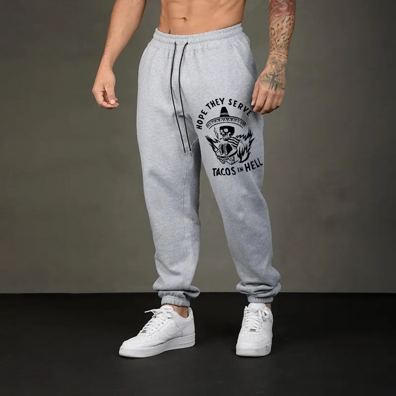 HOPE THEY SERVE TACOS IN HELL SMOKING SKULL GRAPHIC PRINT JOGGERS